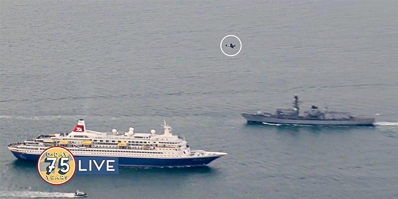 MV Boudicca sailing from Portsmouth to Normandy and BBMF Spitfire PRXIX PM631 conducting a flypast