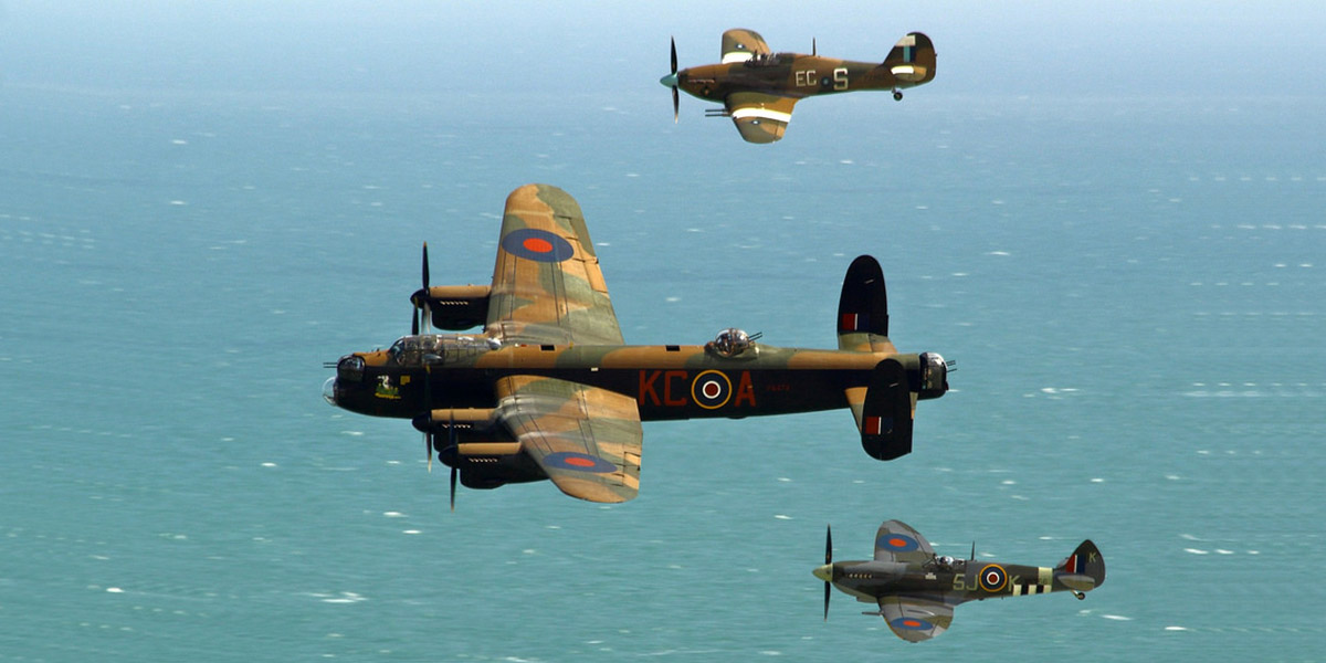 The BBMF three-ship formation of the Lancaster, Spitfire Mk IXe MK356 and Hurricane Mk IIC PZ865 rounds Beachy Head on the run in to Eastbourne to display. 