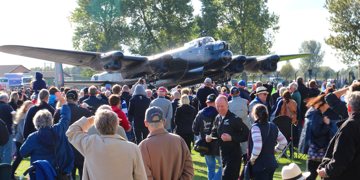 The crowd of 2,500 members were able to get really close to the action. Here the Lancaster taxies in at the end of the display. (photo: Clive Rowley)